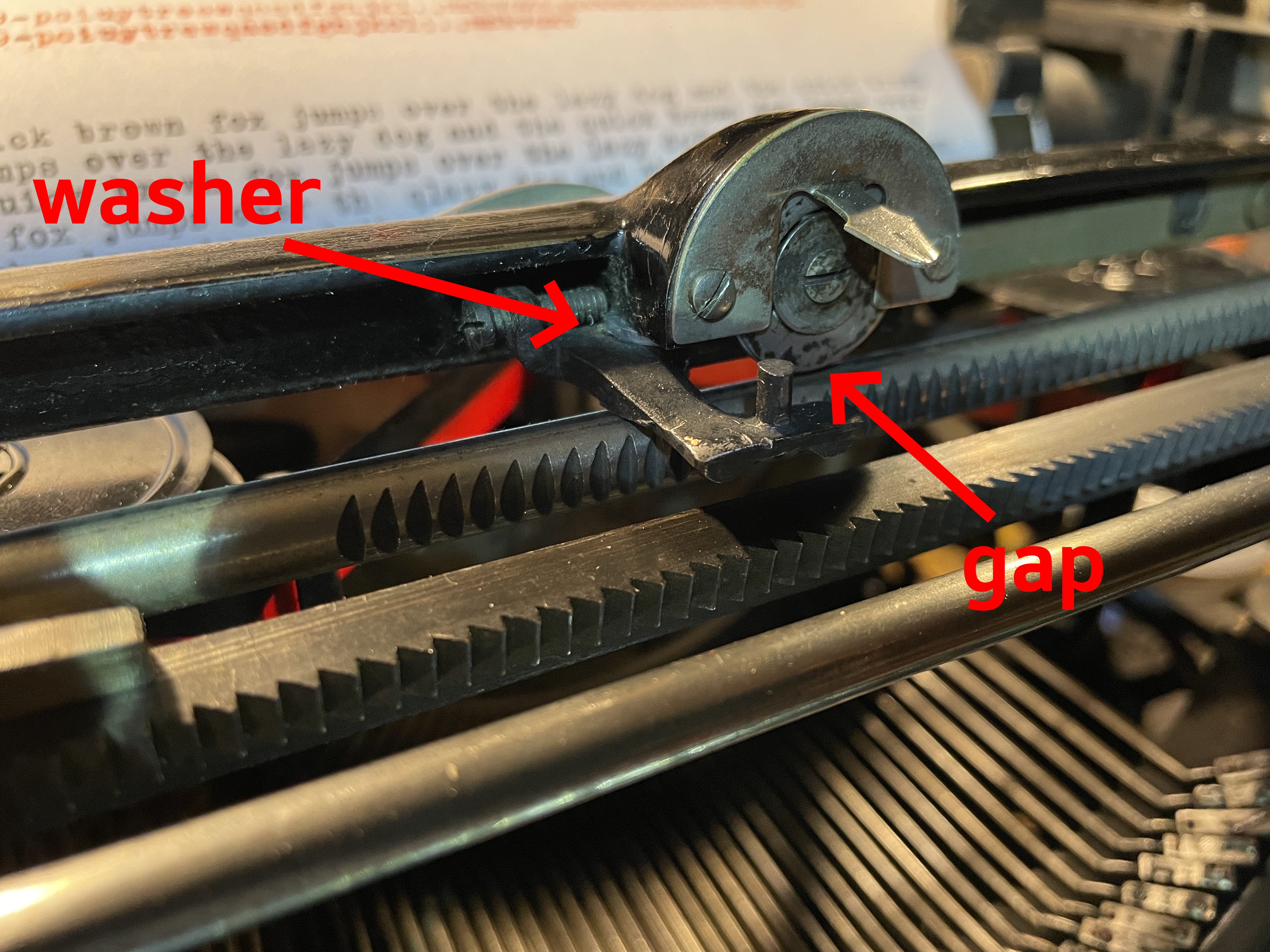 Underwood typewriter bell trip adjuster lowered with two washers but produced gap between carriage frame pointer and its rail