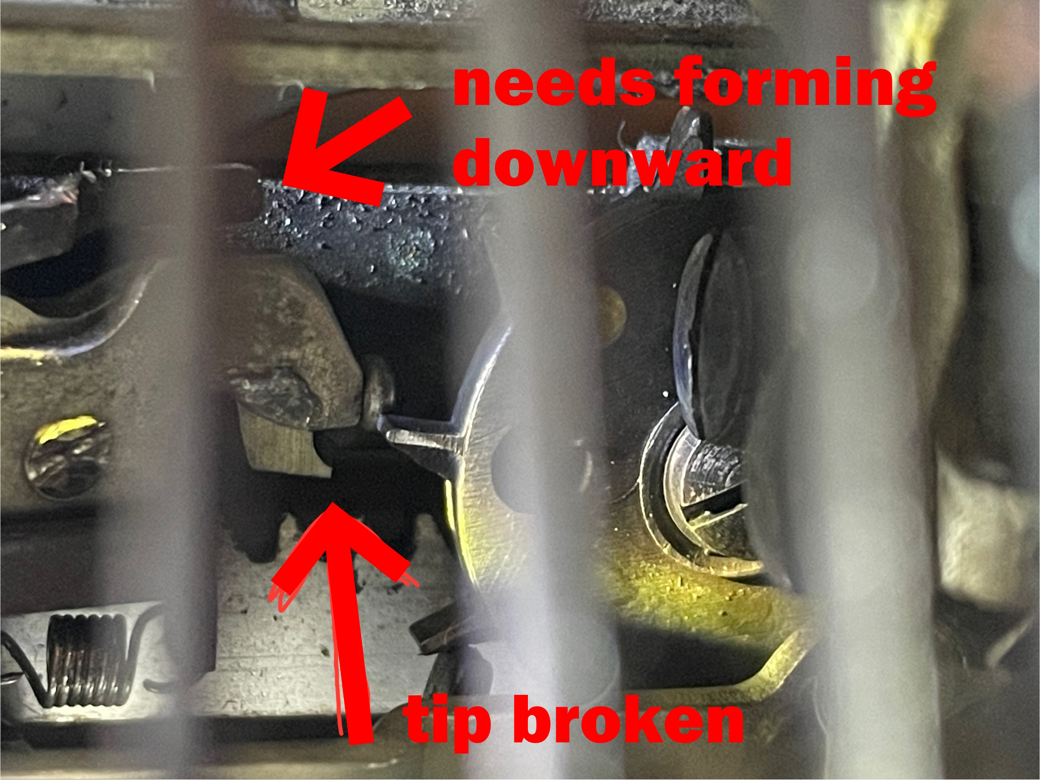 broken tip on loose dog of escapement plate