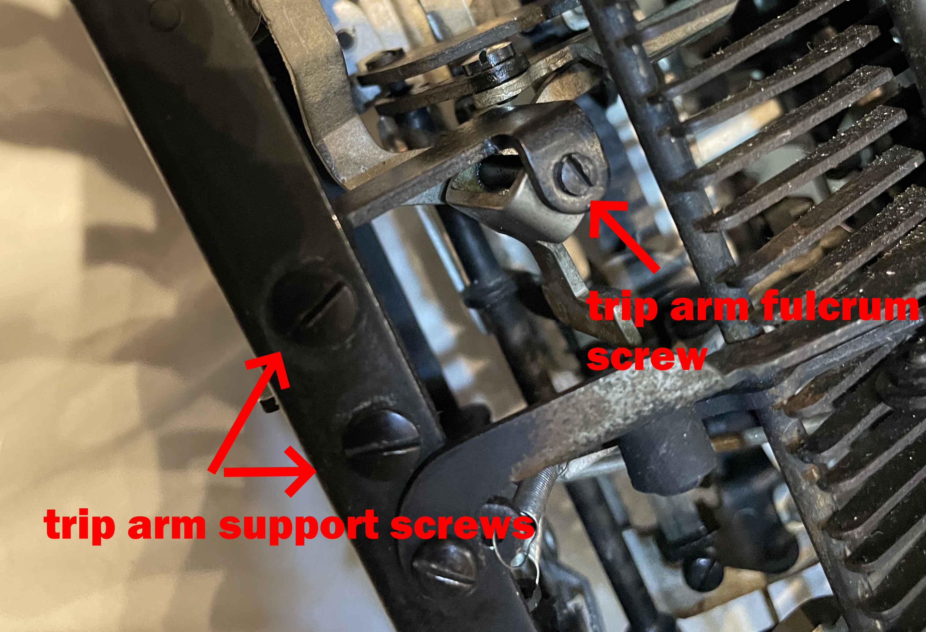 trip arm fulcrum screw and trip arm support screw attachment in a Royal Quiet De Luxe