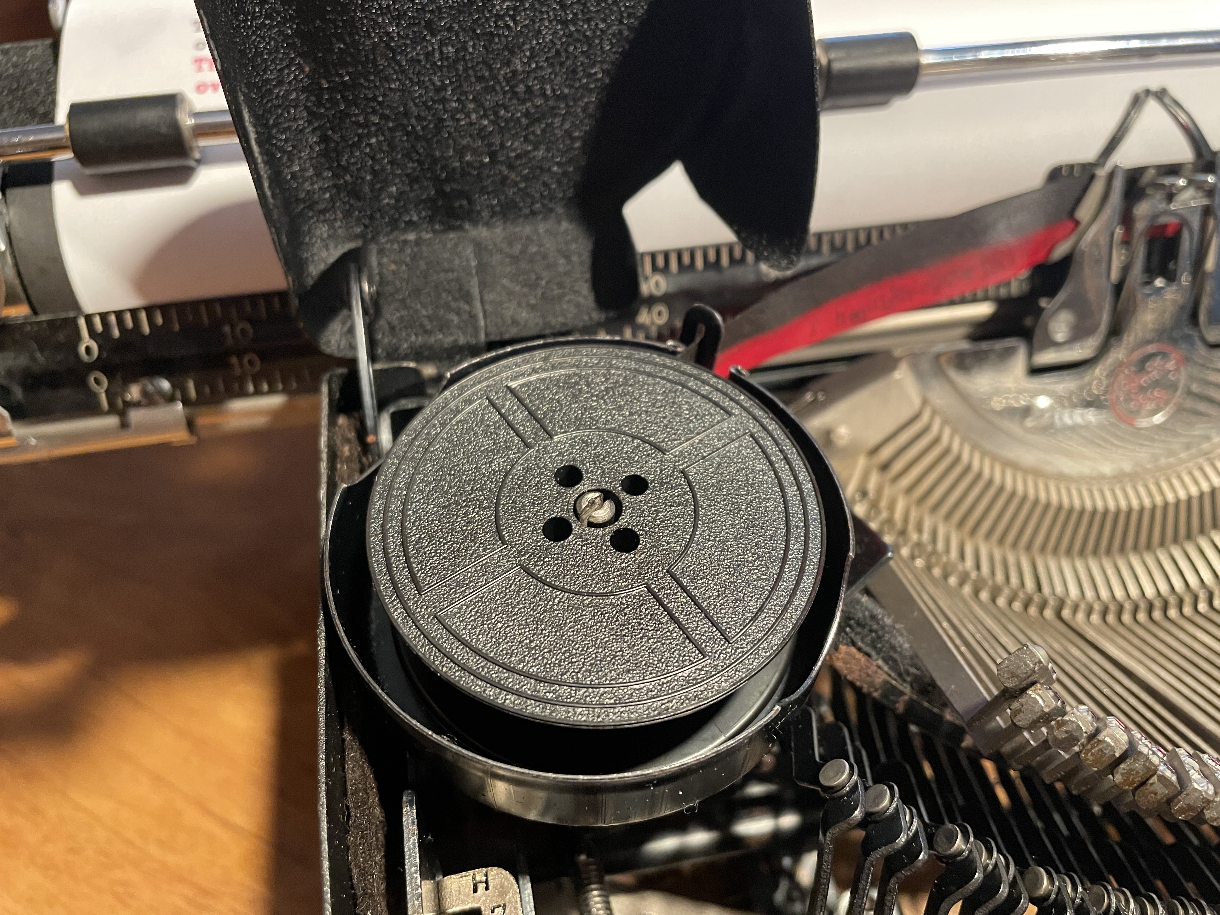 Loose plastic spools fixed the problem with smearing and shading of typed letters on typewriter