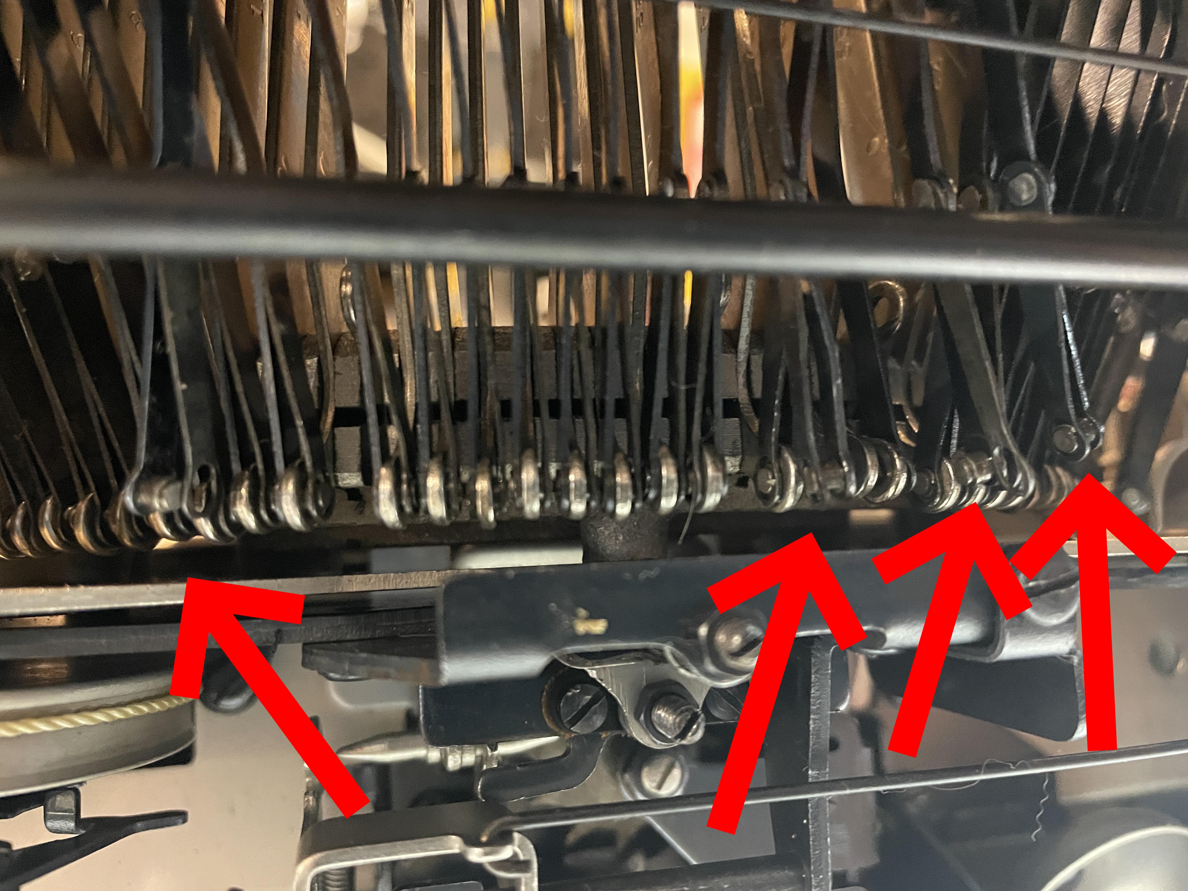 detached clevis connectors to typebars on a 1945 Smith Corona Silent