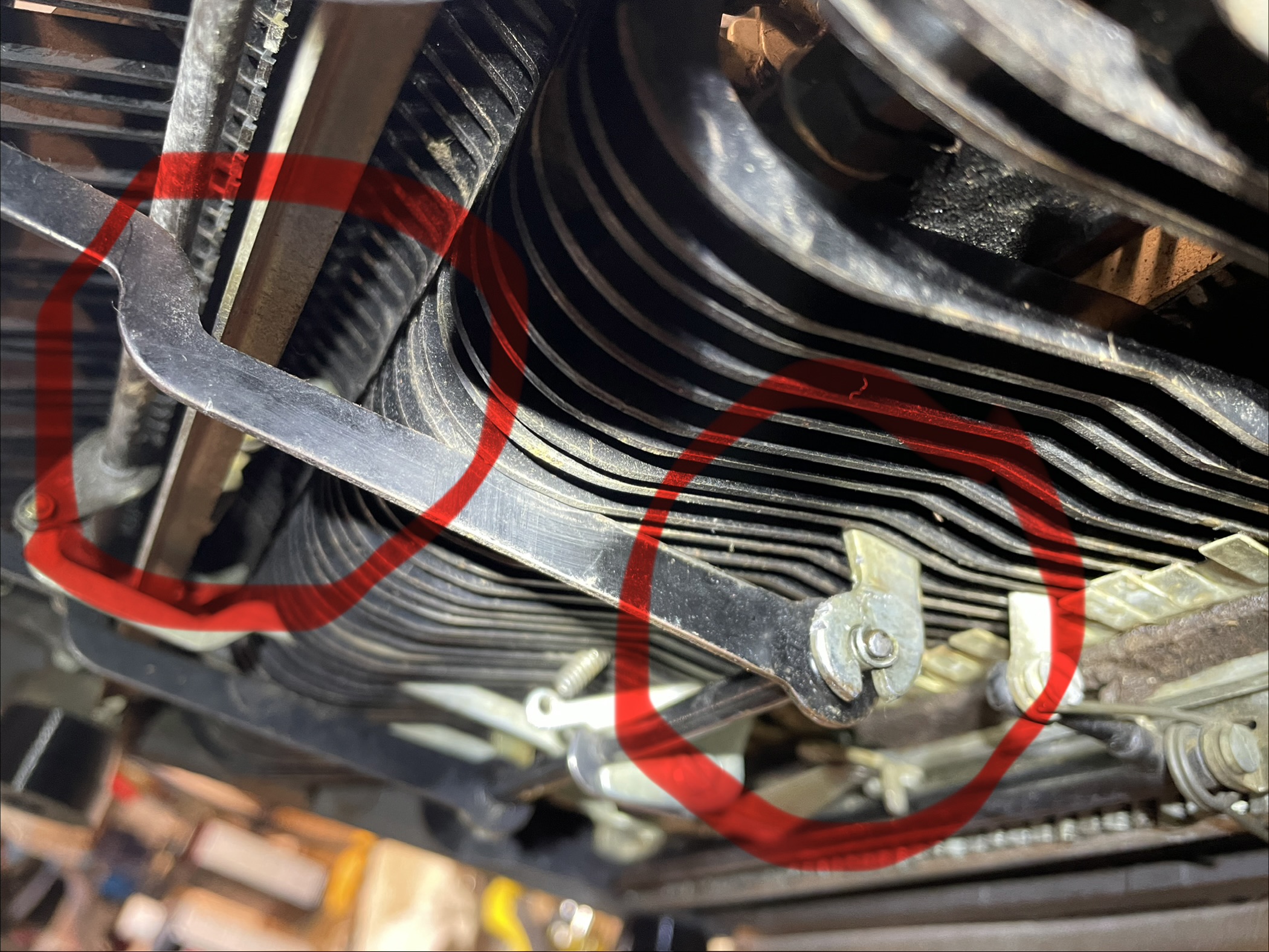 Formed space bar bracket for clearance between space bar and line lock