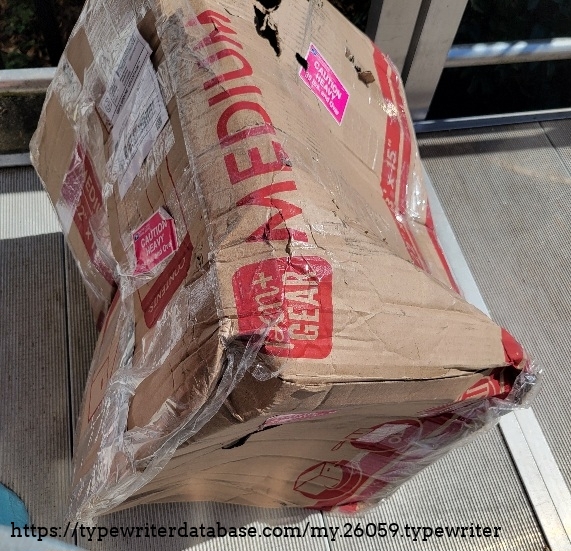 Mangled box from shipping of R. C. Allen VisOmatic A from Mississippi