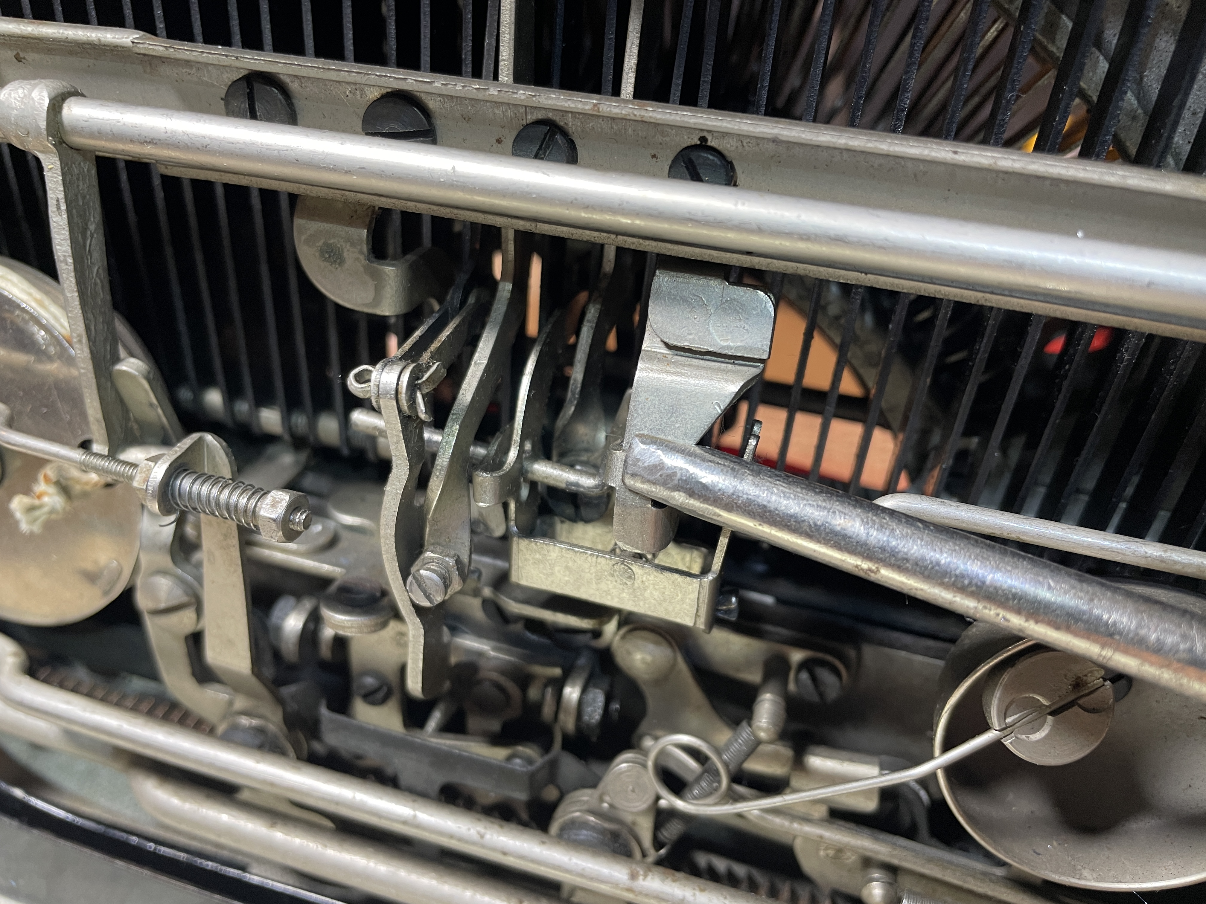 adjusting ribbon cover operating arm for color bleeding on 1934 Remington Portable Model 5 typewriter