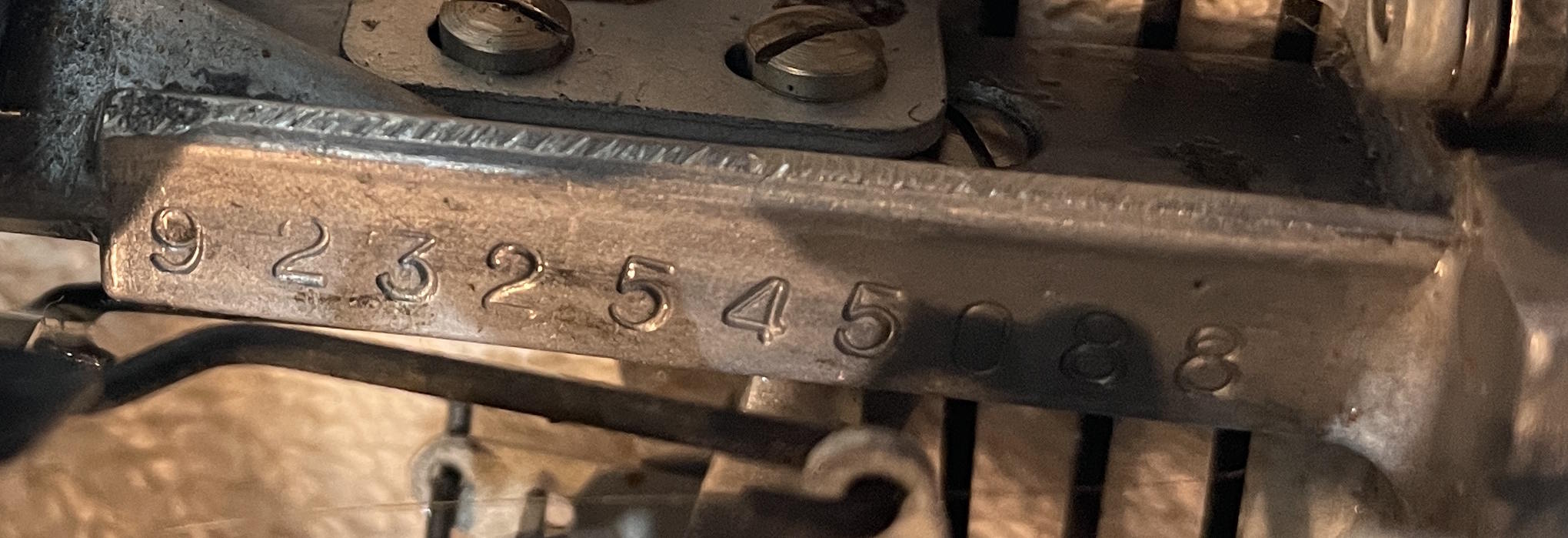 consul 232 serial number is located behind the right ribbon spool