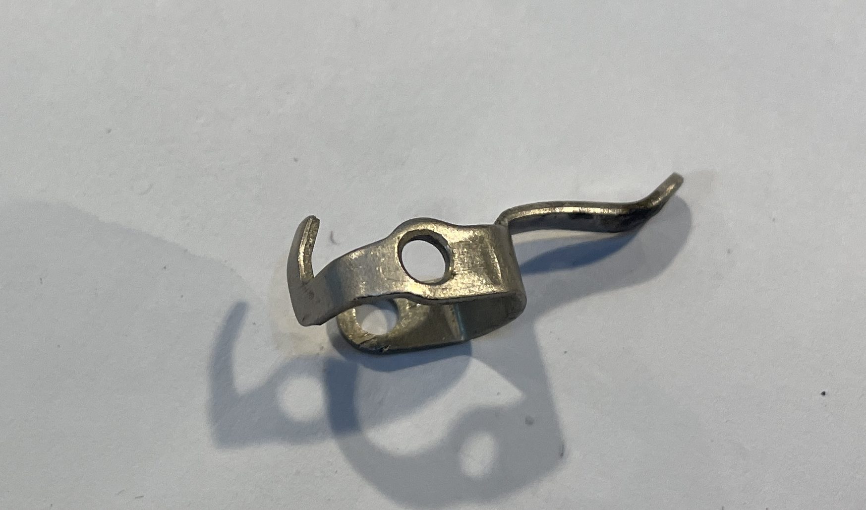Bent ribbon reverse trigger arm removed from 1962 R. C. Allen VisOmatic A