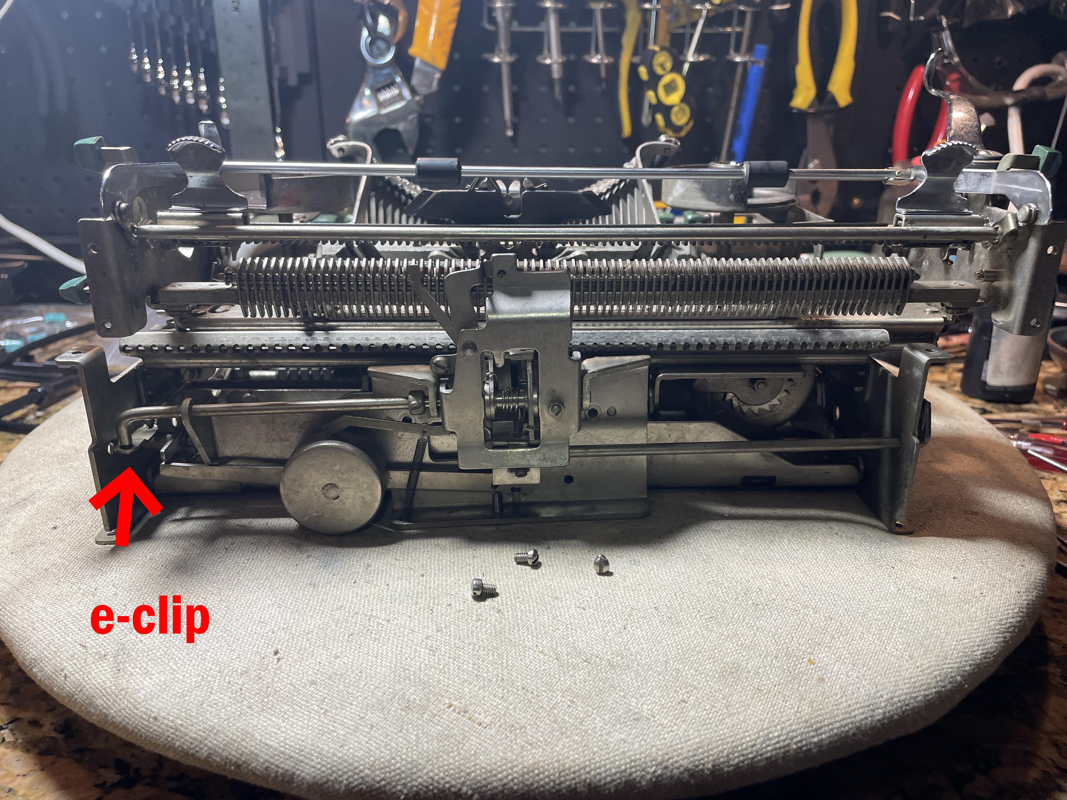 removing e-clip from margin bracket of 1958 Remington Quiet-Riter typewriter