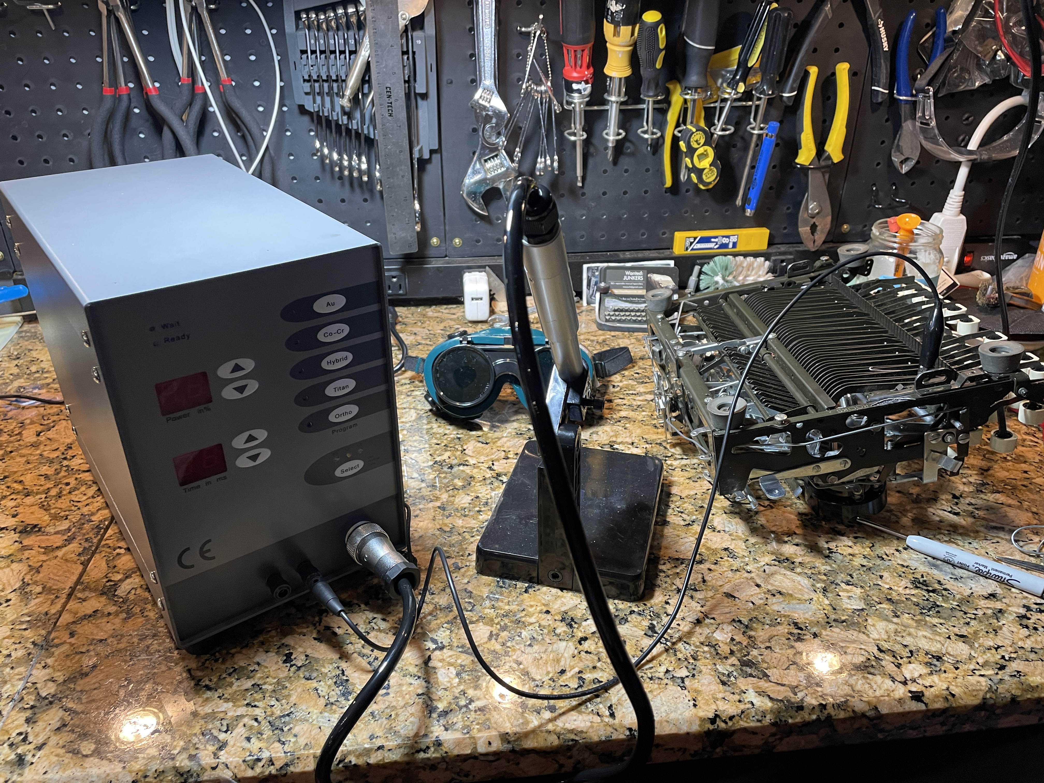 testing Tooltos mini pulse welder on parts machine typewriter