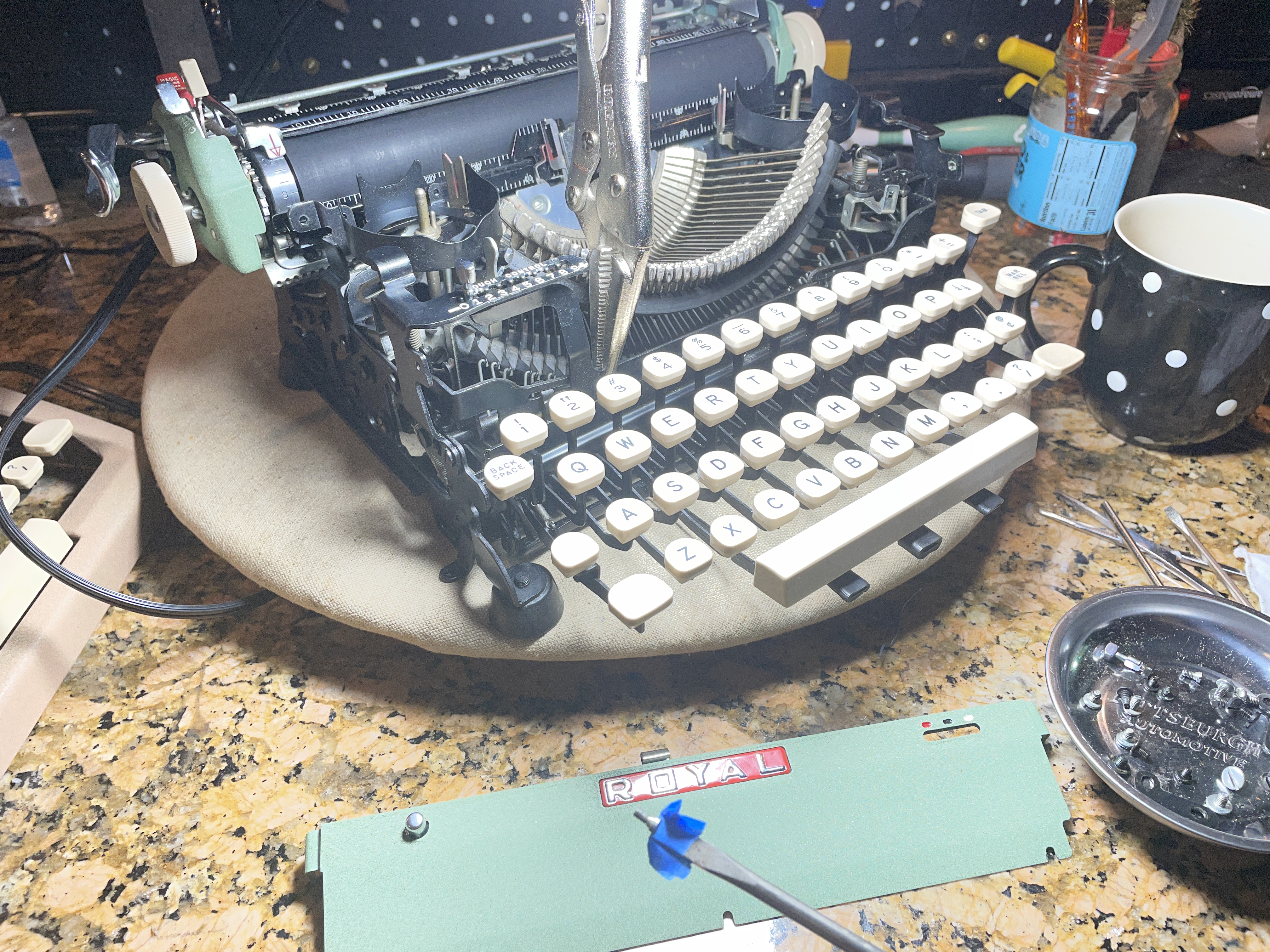 channel lock pliers to help with reassembly of 1957 Royal Quiet De Luxe with broken shift and shift lock keys on left