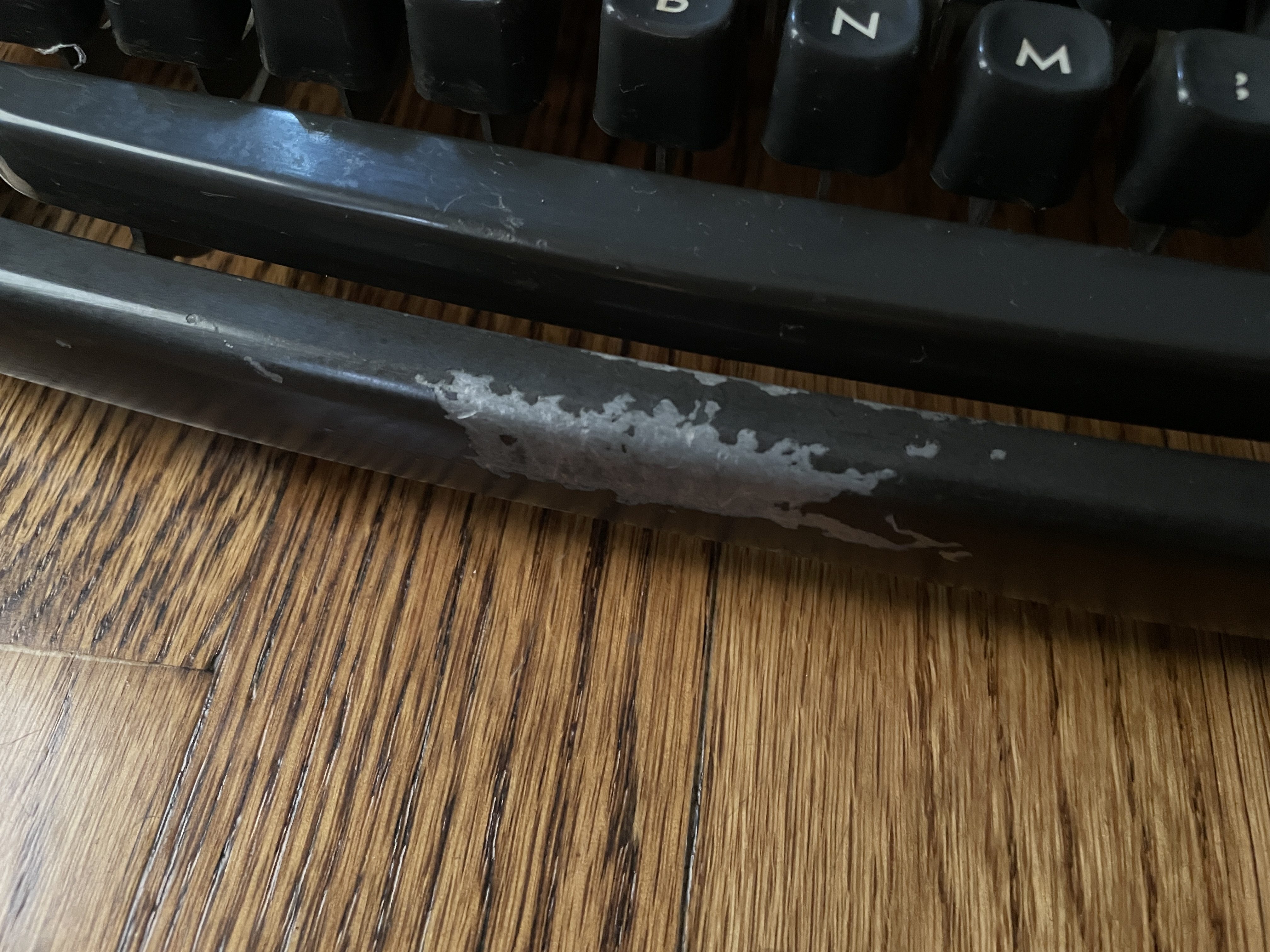 battered paint on 1949 Remington All-New Portable