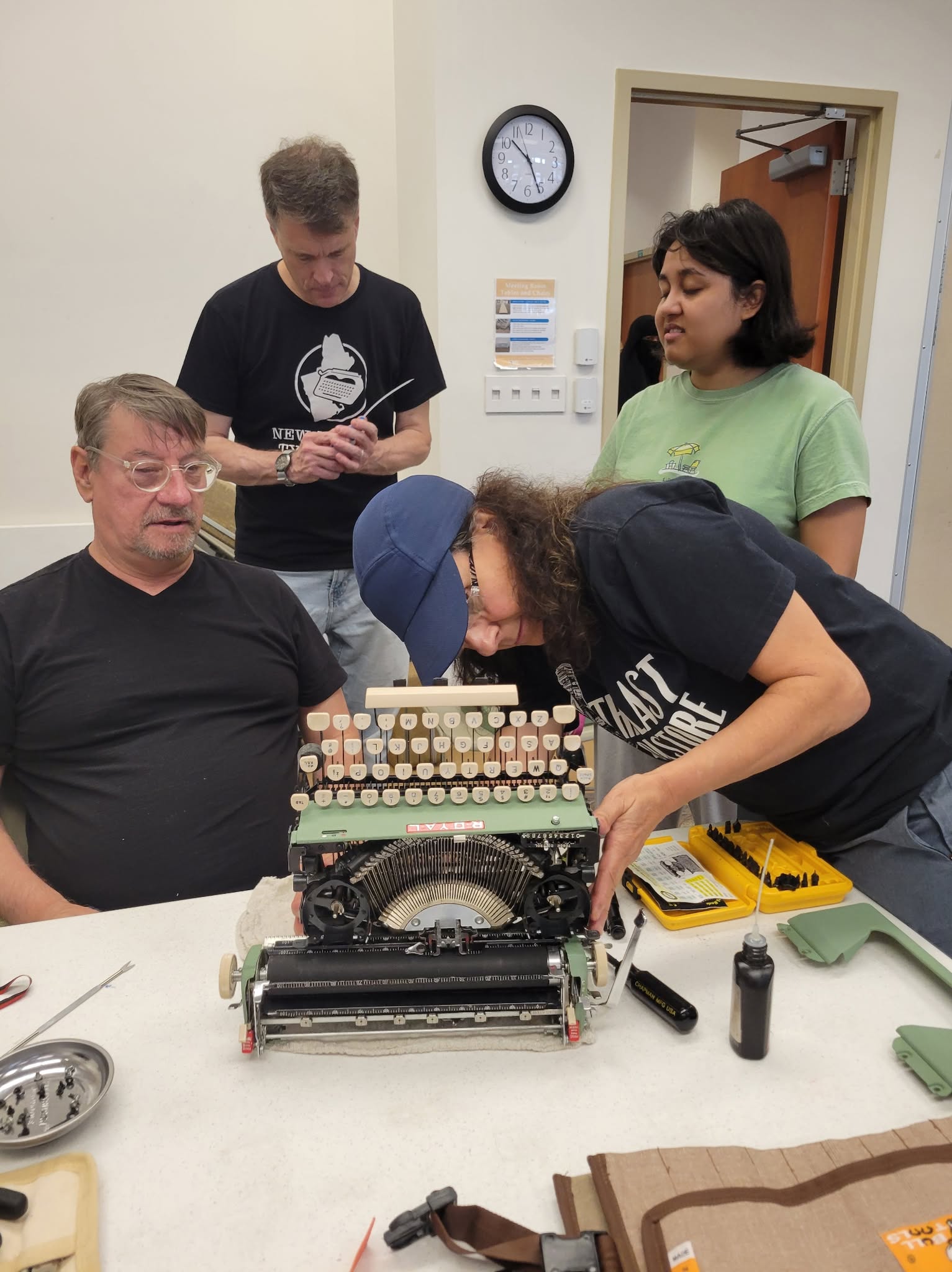 examining 1957 Royal Quiet De Luxe with broken shift and shift lock keys on left