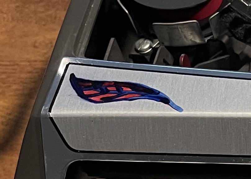 hadn painted feather on Smith-Corona Corsair Deluxe made in England