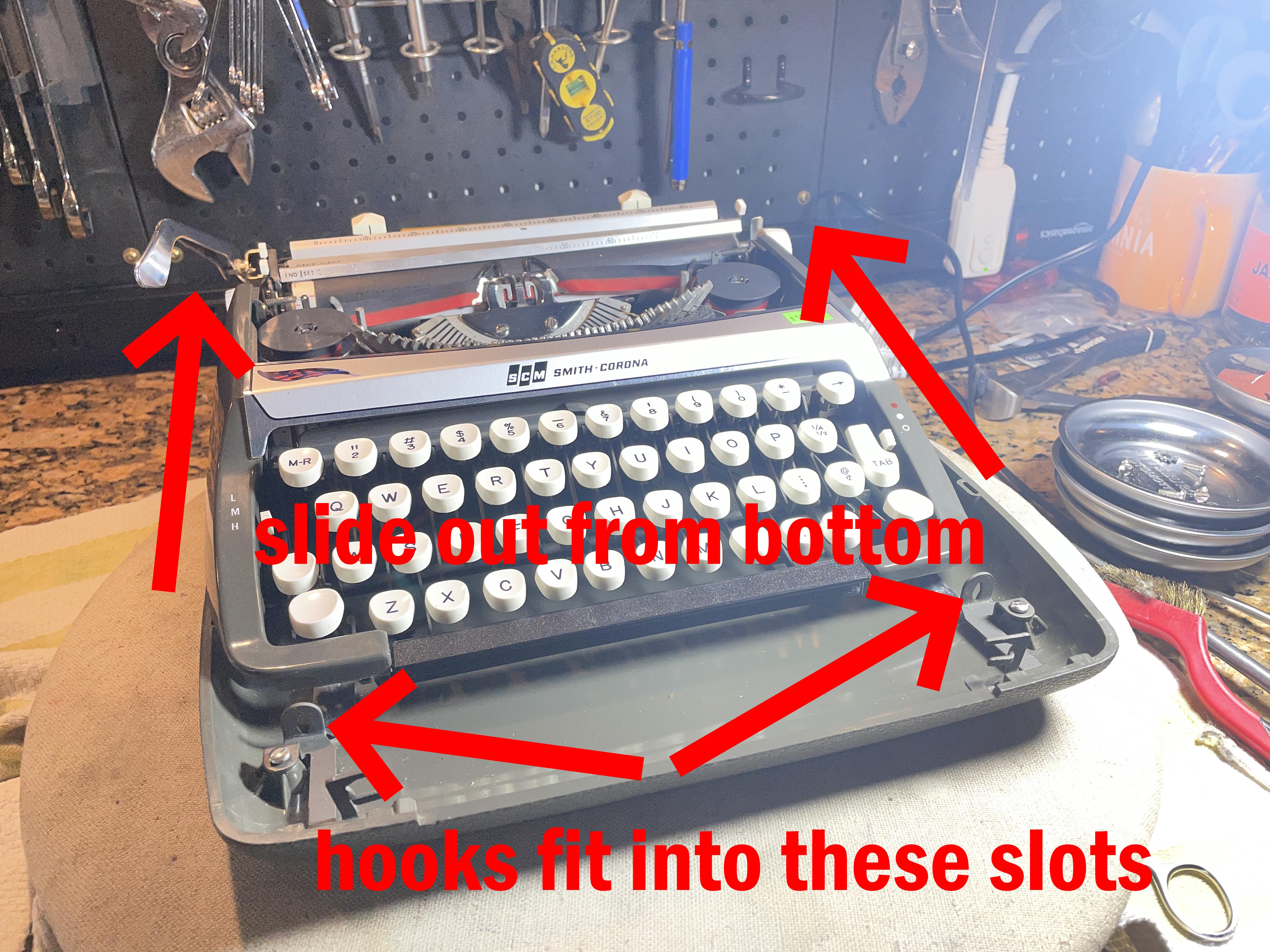 slide machine rearward out of bottom shell